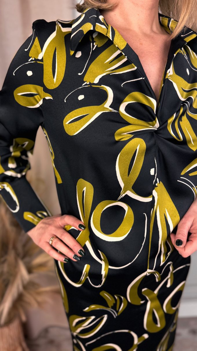 Dress with decorative neckline
